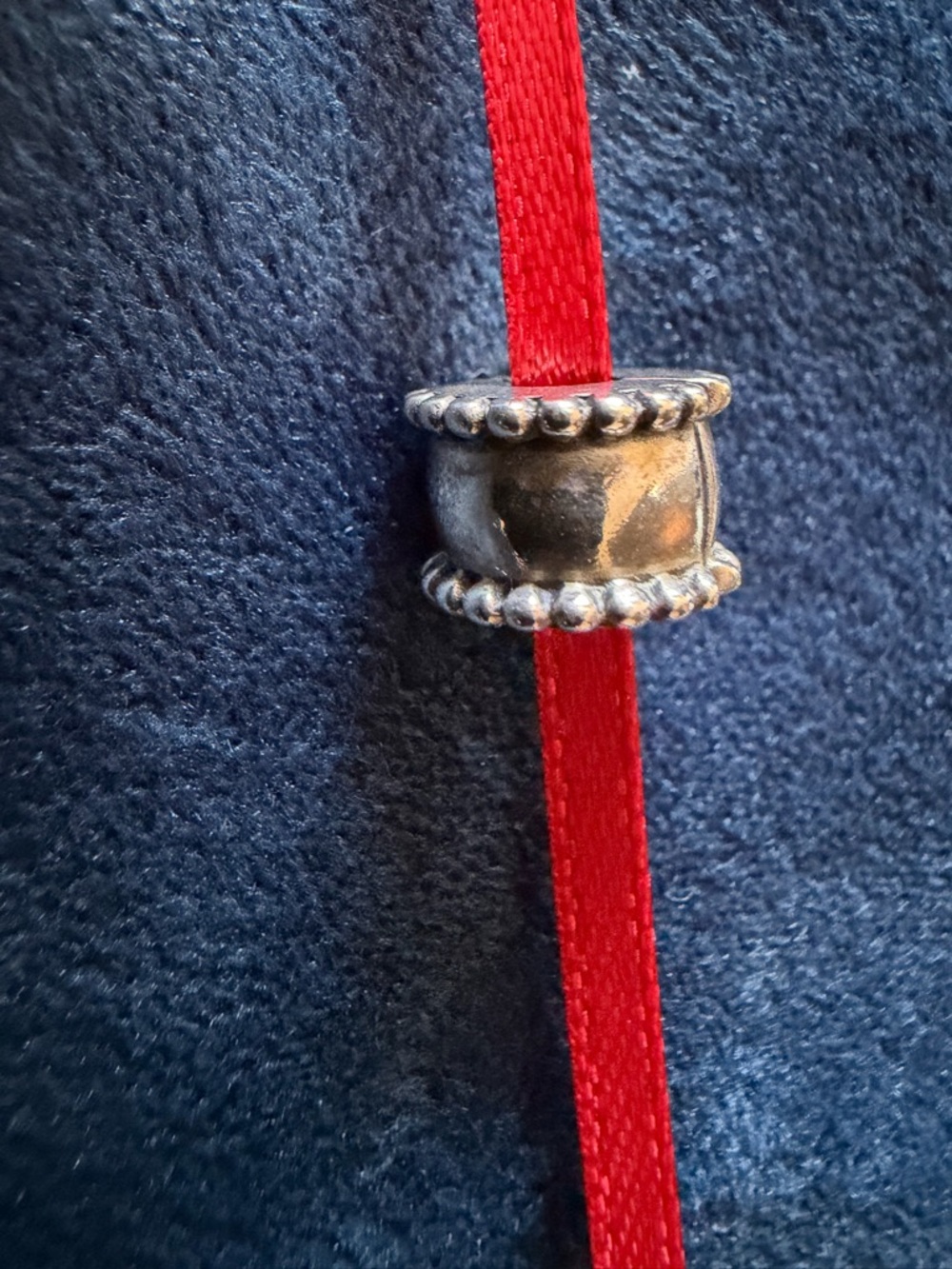 Silver Bead Spacer on Red Ribbon